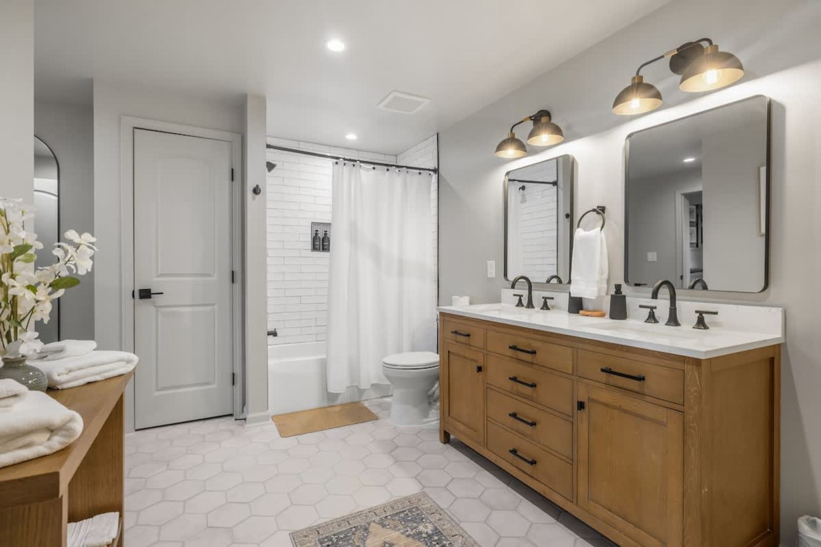 Primary bathroom with a double vanity and a walk-in shower