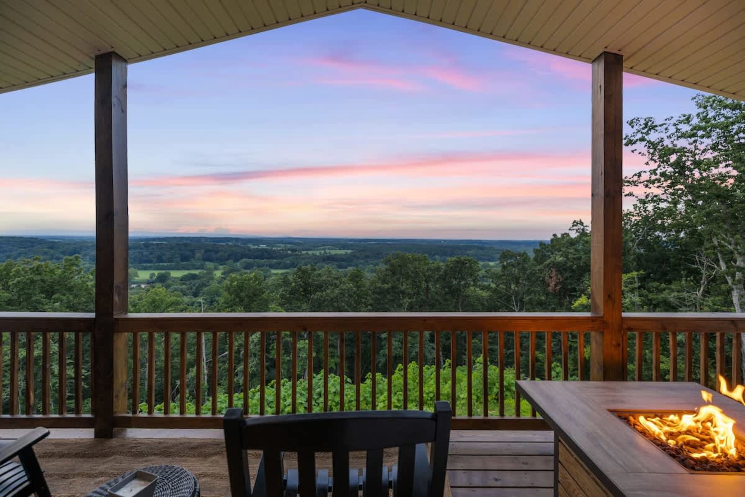 Fire pit on the deck with the sun setting over the Shenandoah Valley