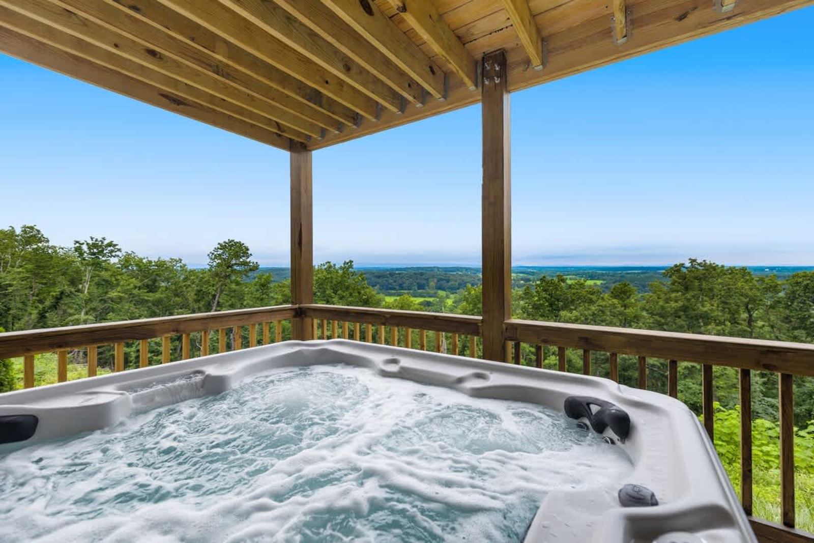Private hot tub on the covered deck looking out over the Shenandoah Valley