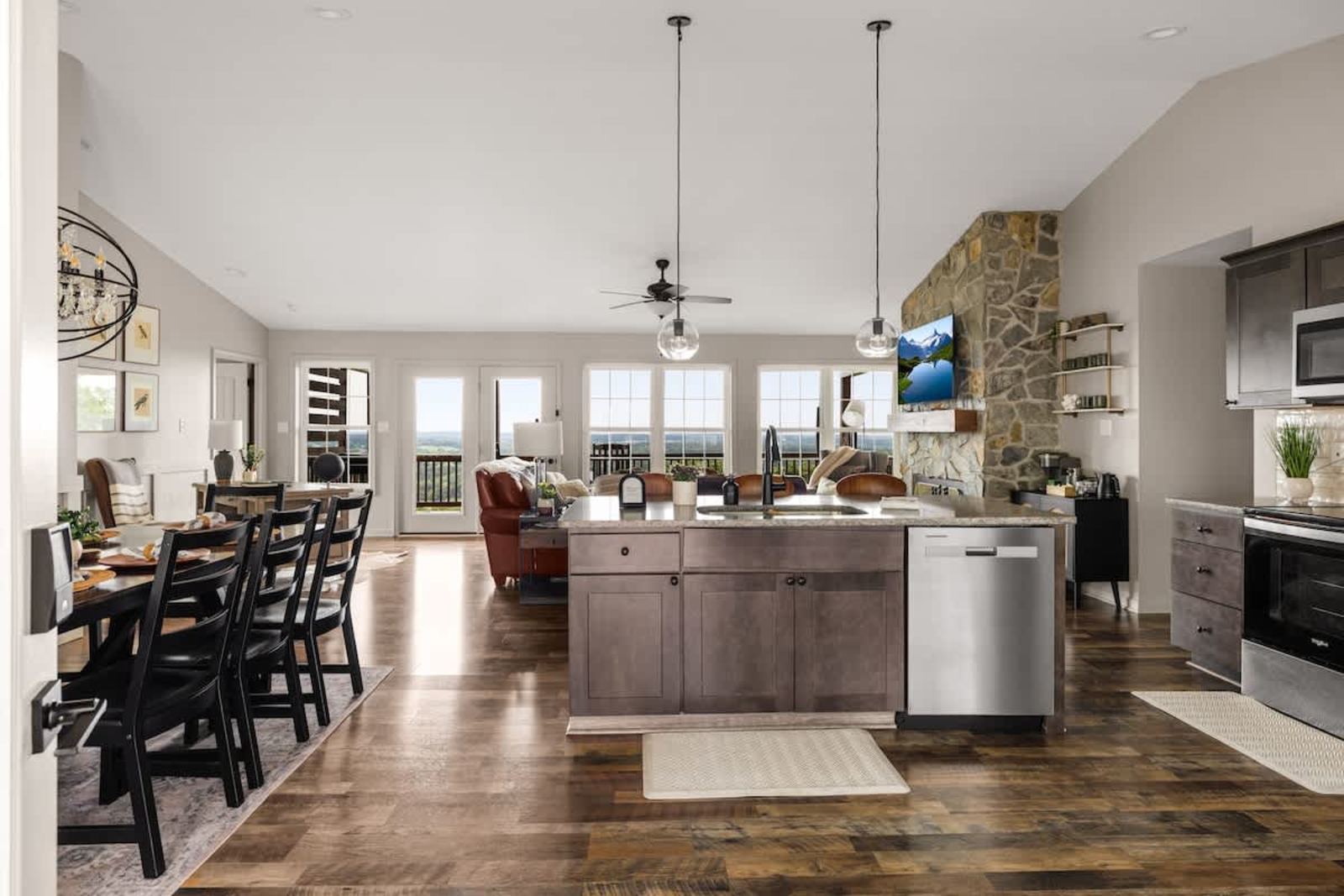Open kitchen and dining area with mountain views through wide windows