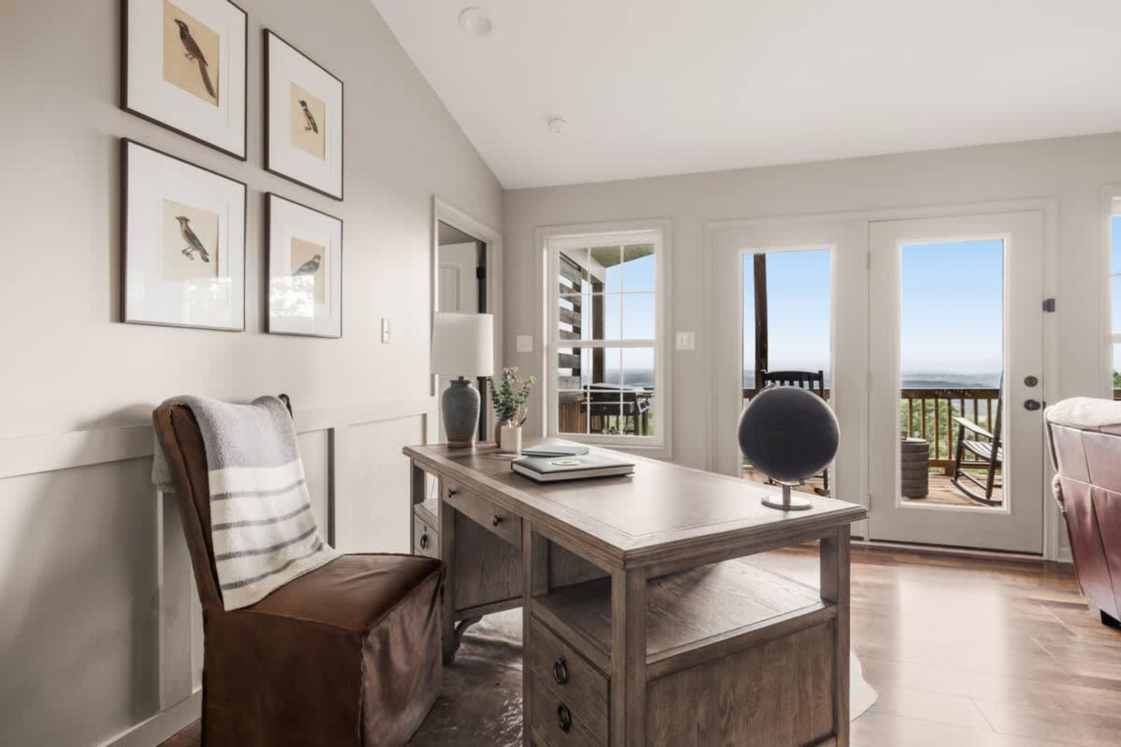 Bright home office with French doors to the deck and a mountain view